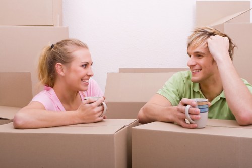 Removals team handling boxes and furniture during an urgent Harrow move