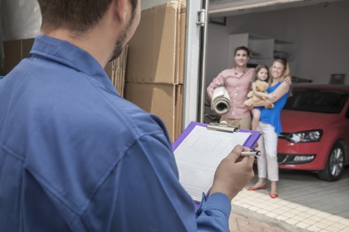 Man and van loading furniture in a Harrow residential street
