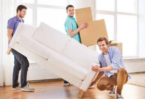 Boxes and household items being carried for a Harrow move