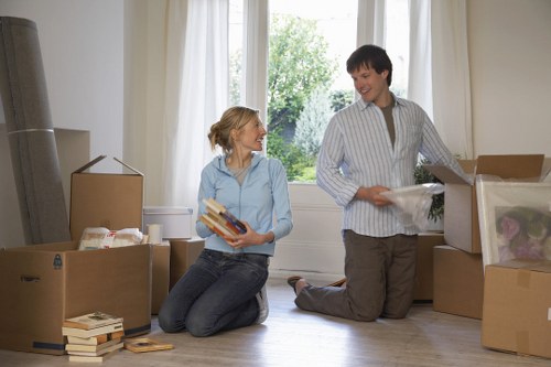Moving equipment and packed boxes ready for an apartment removal in Harrow