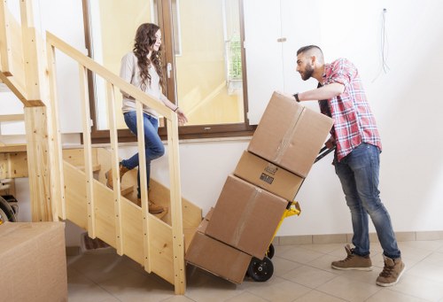 Local furniture collection service loading items for removal in Harrow