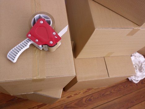 Professional movers handling furniture in a Harrow property