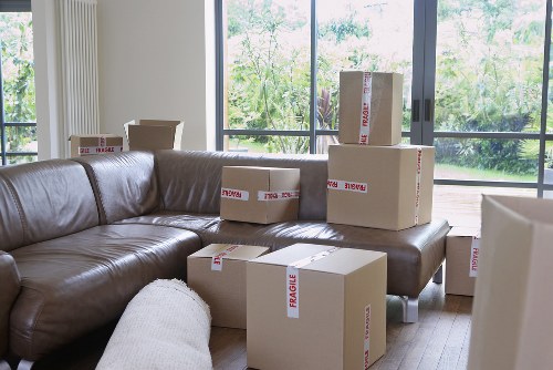 Moving office desks and chairs during a furniture pick-up in Harrow